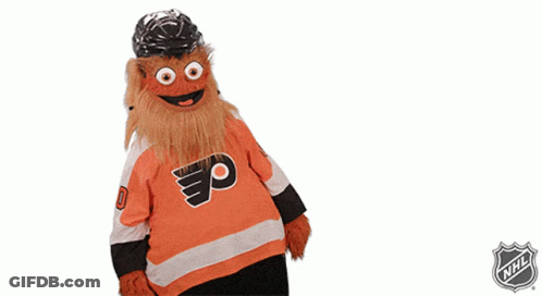 A Mascot Wearing A Flyers Jersey With A Helmet On His Head GIF