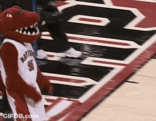 A Mascot Wearing A Jersey That Says Raptors 96 GIF