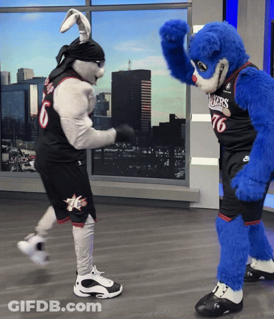 A Mascot Wearing A Number 76 Jersey Stands Next To A Bunny Mascot GIF