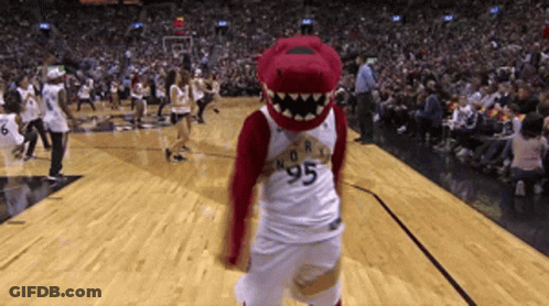 A Mascot Wearing A Number 95 Jersey Stands On A Basketball Court GIF