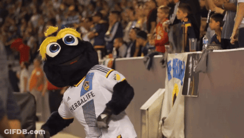 A Mascot With A Herbalife Shirt On GIF