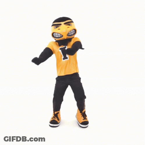 A Mascot With The Letter I On His Shirt Is Dancing GIF