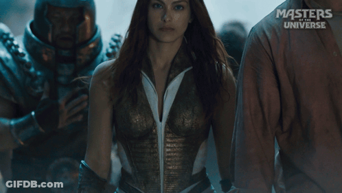 A Masters Of The Universe Poster Features A Woman In A White Shirt GIF