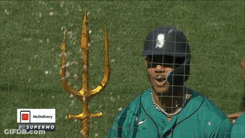A Mcdonald 'S Advertisement With A Trident On The Field GIF