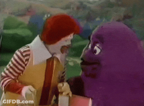 A Mcdonald 'S Clown And A Mcdonald 'S Purple Character Are Standing Next To Each Other GIF