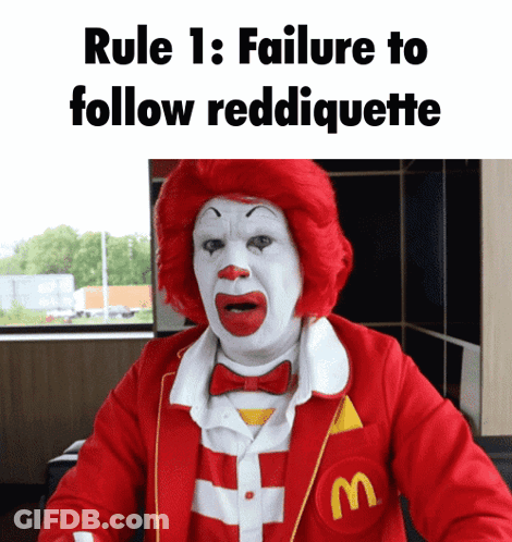 A Mcdonald 'S Clown With A Red Wig And White Face GIF
