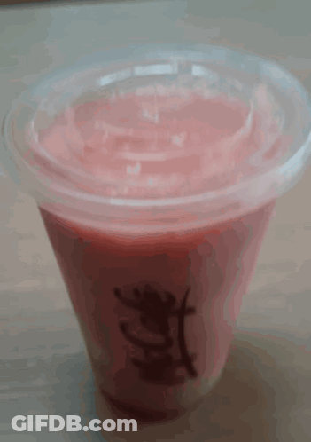A Mcdonald 'S Cup Filled With Pink Liquid GIF