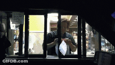 A Mcdonald 'S Drive Thru Window Has A Sign On It That Says ' No Smoking ' On It GIF