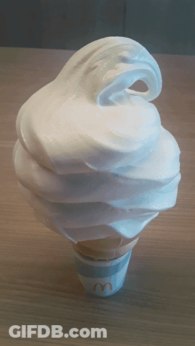 A Mcdonald 'S Ice Cream Cone With Whipped Cream GIF