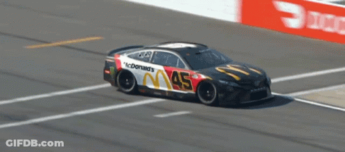 A Mcdonald 'S Race Car Is On The Track GIF