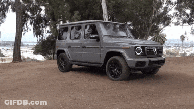 A Mercedes Is Parked On A Dirt Road GIF
