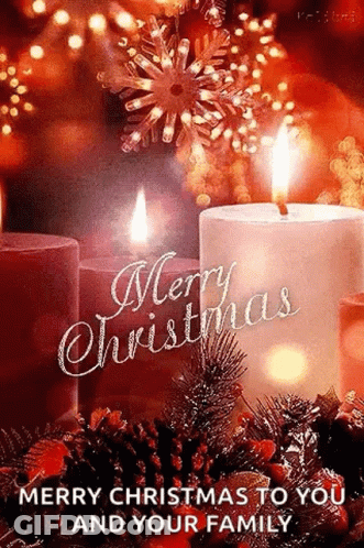 A Merry Christmas To You And Your Family Greeting Card With Two Lit Candles . GIF