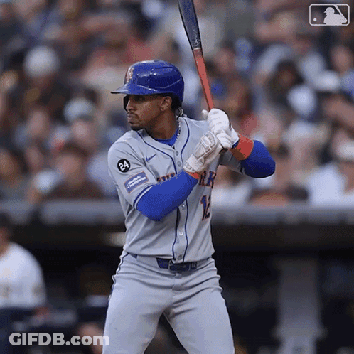 A Mets Baseball Player Is Getting Ready To Swing His Bat GIF