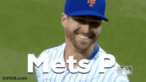 A Mets Baseball Player Is Smiling And Wearing A Blue Cap GIF