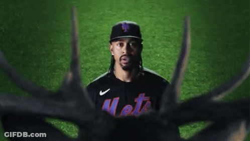 A Mets Baseball Player Stands In Front Of A Deer GIF