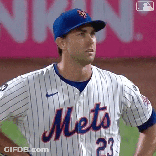 A Mets Baseball Player Wearing A Blue Hat And Jersey GIF