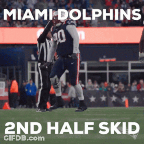 A Miami Dolphins Football Player Celebrates With A Referee GIF