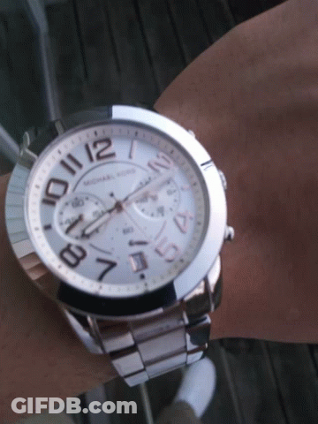 A Michael Kors Watch On A Person 'S Wrist GIF