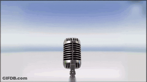 A Microphone With A Green Gummy Bear Behind It GIF
