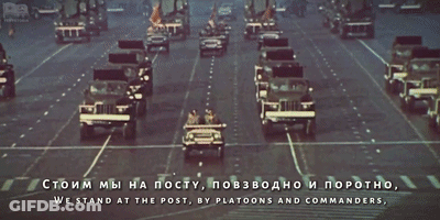 A Military Parade In A Foreign Language With The Words We Stand At The Post In The Lower Right Corner GIF