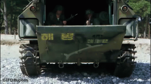 A Military Vehicle Has The Number 2 On The Back GIF
