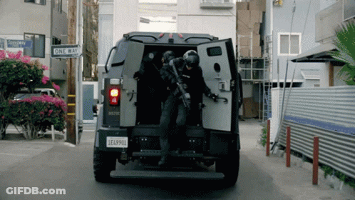 A Military Vehicle With A License Plate That Says Lea4900 GIF