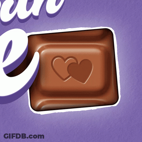 A Milka Chocolate Bar With Two Hearts Carved Into It GIF