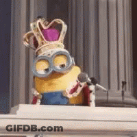 A Minion Is Wearing A Crown And Sitting At A Piano . GIF