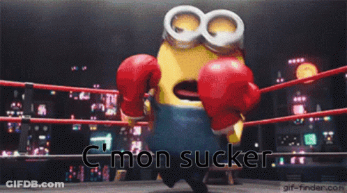 A Minion Wearing Boxing Gloves In A Boxing Ring With The Words C Mon Sucker Below Him GIF