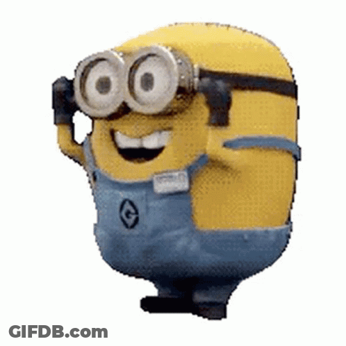 A Minion Wearing Goggles And Overalls Is Smiling . GIF