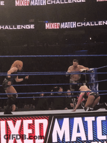 A Mixed Match Challenge Is Being Held In A Ring GIF