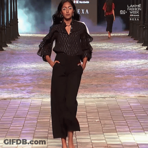 A Model Walks Down A Runway At A Lakme Fashion Week GIF