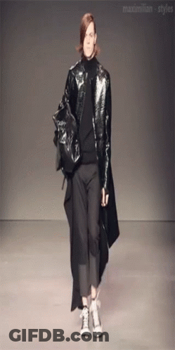 A Model Walks Down The Runway At A Fashion Show Sponsored By Maximilian-Styles GIF