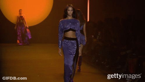 A Model Walks Down The Runway At A Fashion Show With The Caption Gettyimages GIF