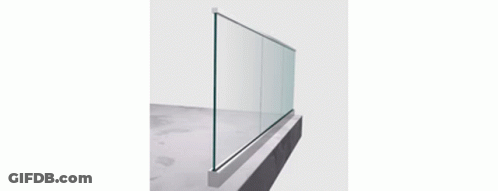 A Modern Staircase With Wooden Steps And A Glass Railing In A House . GIF
