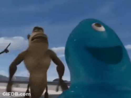 A Monkey And A Blue Monster Are Standing Next To Each Other On A Beach . GIF