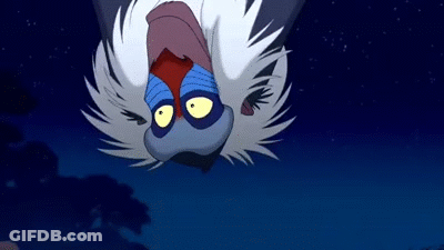 A Monkey From The Lion King Is Flying Upside Down In The Air . GIF