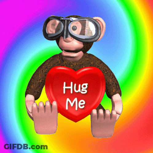 A Monkey Holding A Red Heart That Says Hug Me GIF