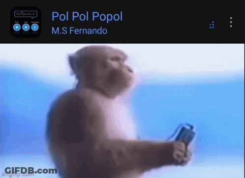 A Monkey Is Holding A Remote Control In Front Of A Screen That Says Pol Pol Popol On It GIF