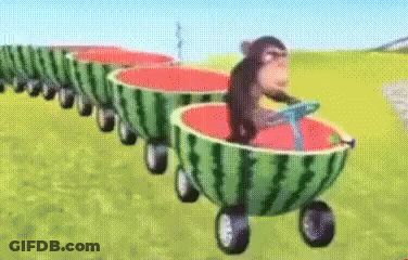A Monkey Is Riding A Train Of Watermelons GIF