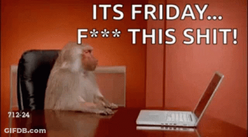 A Monkey Is Sitting At A Desk In Front Of A Laptop With The Words " It 'S Friday F *** This Shit " GIF