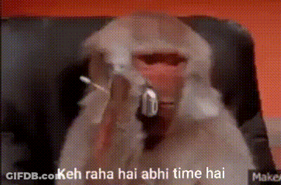 A Monkey Is Sitting In A Chair With A Gun In Its Mouth And Says Keh Raha Hai Abhi Time Hai . GIF