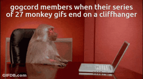 A Monkey Sits At A Desk In Front Of A Laptop With A Red Background GIF