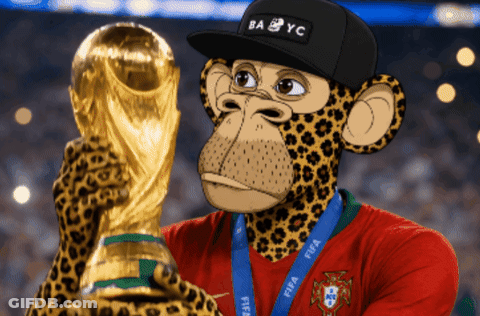 A Monkey Wearing A Hat That Says Ba Yc Holds Up A Trophy GIF