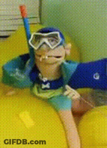 A Monkey Wearing Goggles And A Snorkel Is Floating On A Yellow Raft GIF