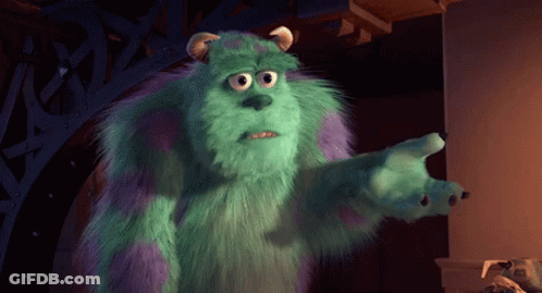A Monster From The Movie Monsters Inc Is Standing In A Dark Room GIF