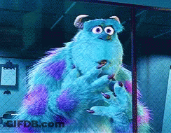 A Monster From The Movie Monsters Inc Is Standing In Front Of A Chain Link Fence GIF