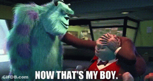 A Monster From The Movie Monsters Inc Is Standing Next To A Man In A Tuxedo . GIF