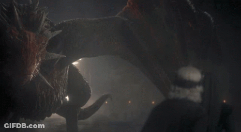 A Monster Is Eating Another Monster In A Cave GIF