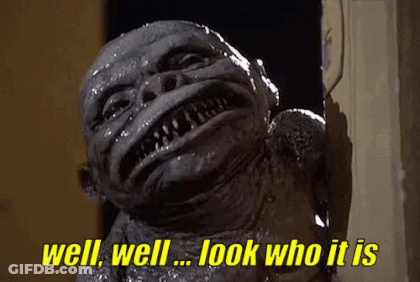 A Monster Is Standing In A Doorway And Says `` Well , Well , Look Who It Is '' . GIF